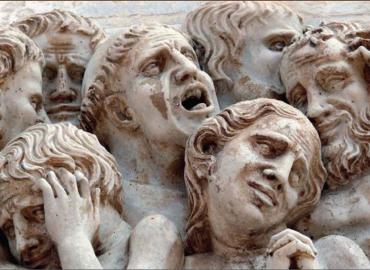 Monk heads carved in stone